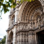 Notre-Dame Cathedral with royal symbols and visitors